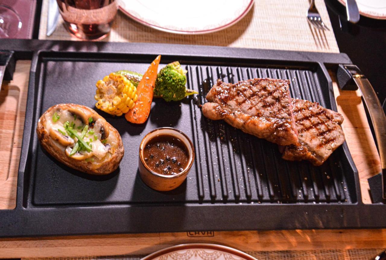 Century Marina Hotel - Lusail Екстериор снимка A steak prepared on a griddle